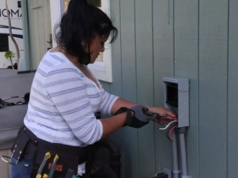 Licensed electrician wiring an exterior subpanel in Masontown